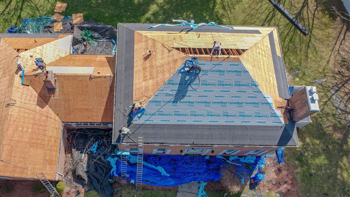 Roofers working on roof